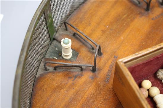 A rare mid 19th century Jaques of London Game of Cannonade of Castle Bagatelle, comprising a circular mahogany board, 38cms diameter,